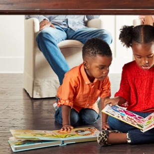 Kids with book | Rocky Mountain Flooring