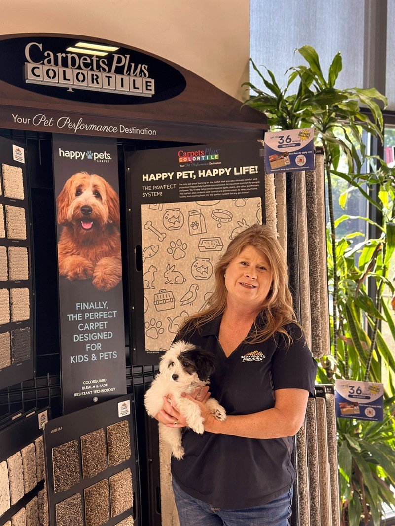 Team member with puppy | Rocky Mountain Flooring